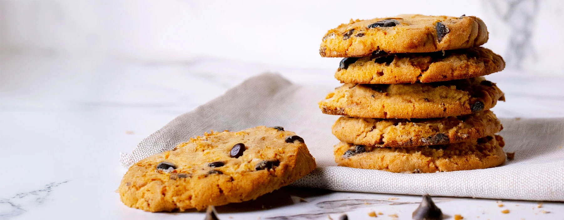 A stack of golden chocolate chip cookies